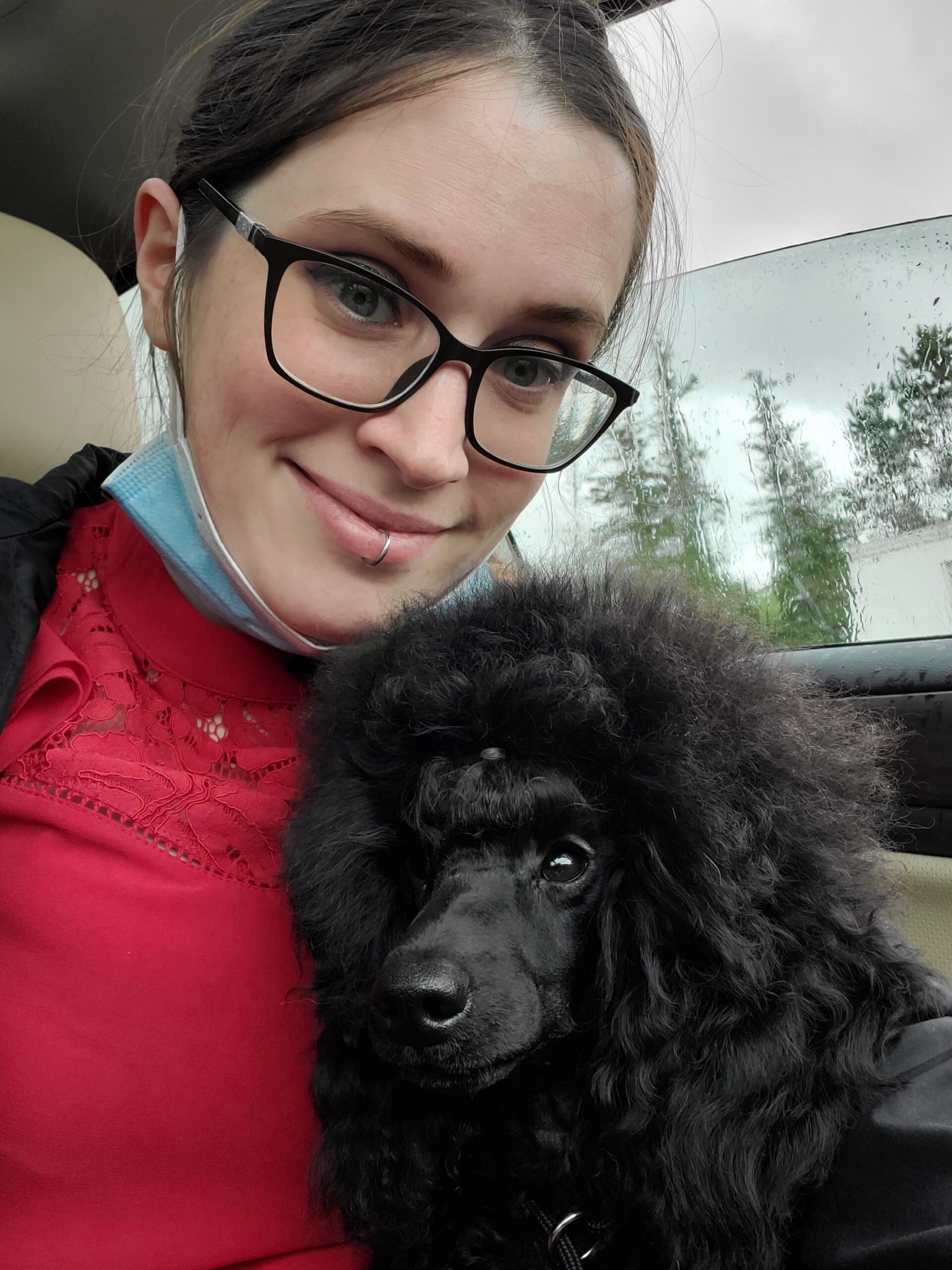 Photo of Keri and a poodle puppy